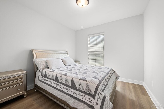 3041 Mountain Laurel Trl, Cantonment, FL 32533 - bedroom featuring baseboards and dark wood-type flooring