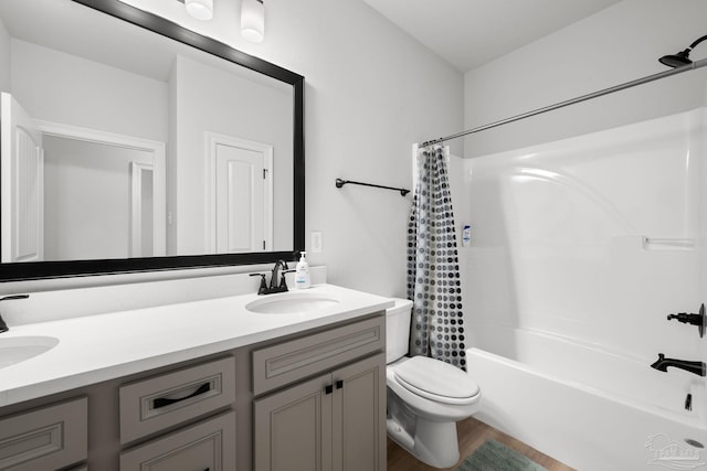 3041 Mountain Laurel Trl, Cantonment, FL 32533 - bathroom with a sink, double vanity, toilet, wood finished floors, and shower / tub combo