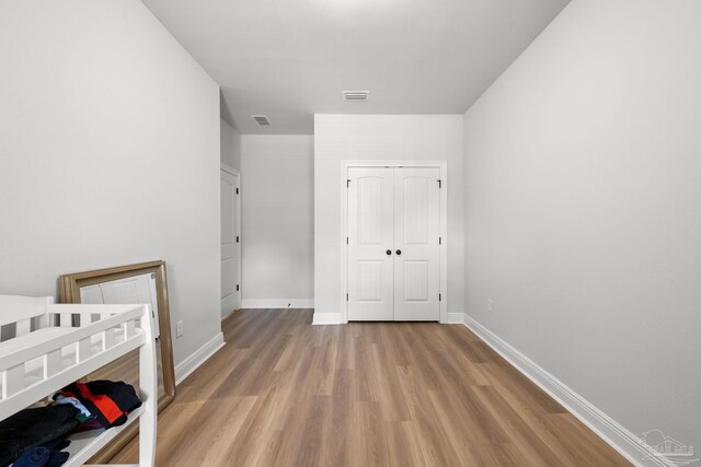 3041 Mountain Laurel Trl, Cantonment, FL 32533 - unfurnished bedroom featuring visible vents, light wood-style flooring, and baseboards