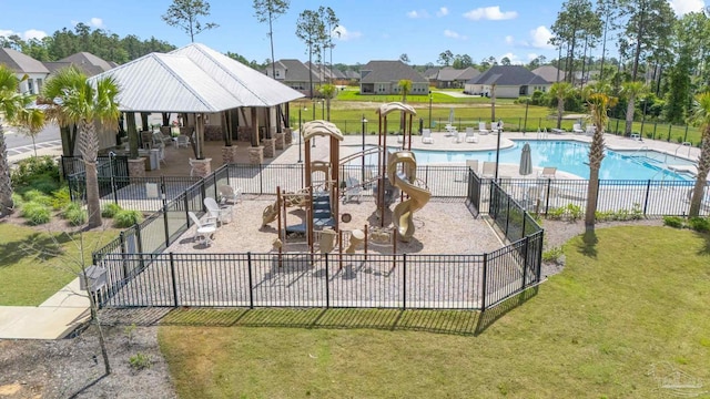 3041 Mountain Laurel Trl, Cantonment, FL 32533 - community pool featuring a yard, a patio, fence, and a residential view
