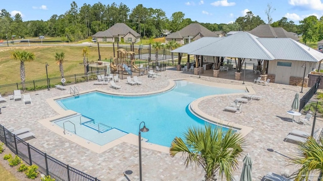3041 Mountain Laurel Trl, Cantonment, FL 32533 - community pool featuring a patio and fence