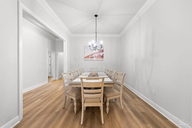 3041 Mountain Laurel Trl, Cantonment, FL 32533 - dining room with baseboards, a notable chandelier, and light wood-style flooring