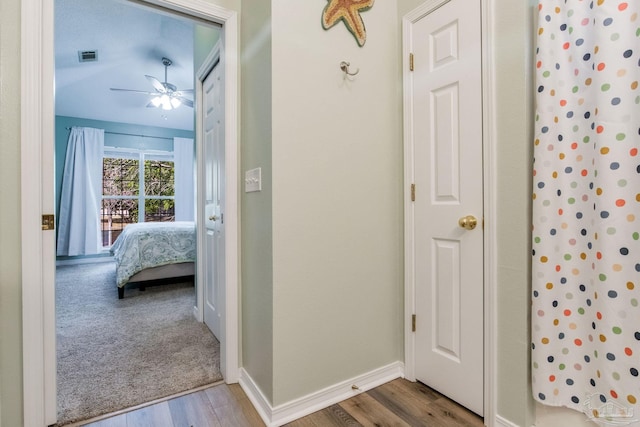 7101 Joy St Unit C8, Pensacola, FL 32504 - full bathroom featuring a ceiling fan, wood finished floors, ensuite bathroom, and baseboards