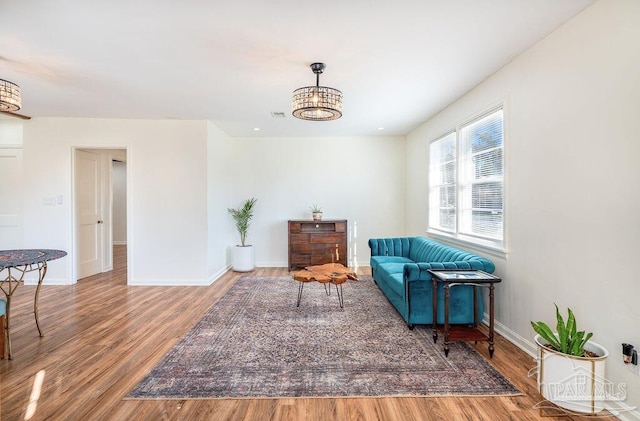 living area with hardwood / wood-style floors