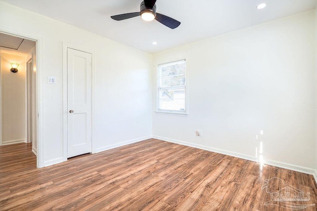 empty room featuring ceiling fan and wood-type flooring