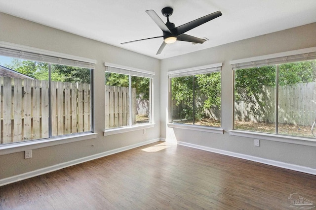 4741 Huron Dr, Pensacola, FL 32507 - unfurnished sunroom featuring wood finished floors and baseboards