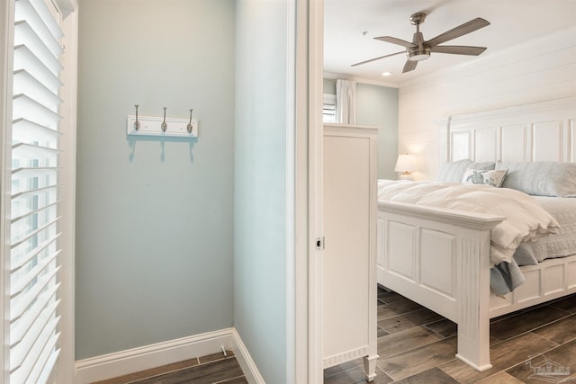 bedroom with wood finish floors, ceiling fan, and baseboards