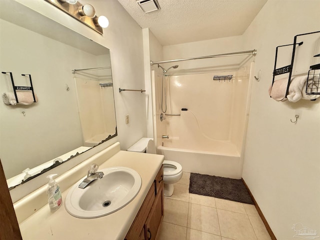 full bathroom with tile patterned floors, toilet, shower / bathing tub combination, a textured ceiling, and vanity