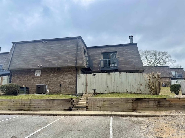 view of side of property with cooling unit