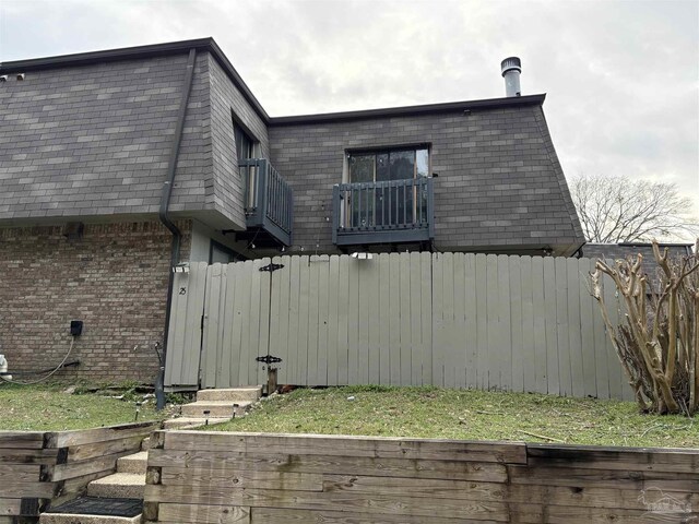 view of property exterior featuring a balcony