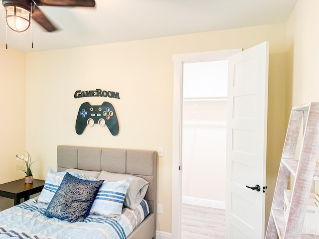 bedroom featuring hardwood / wood-style flooring and ceiling fan