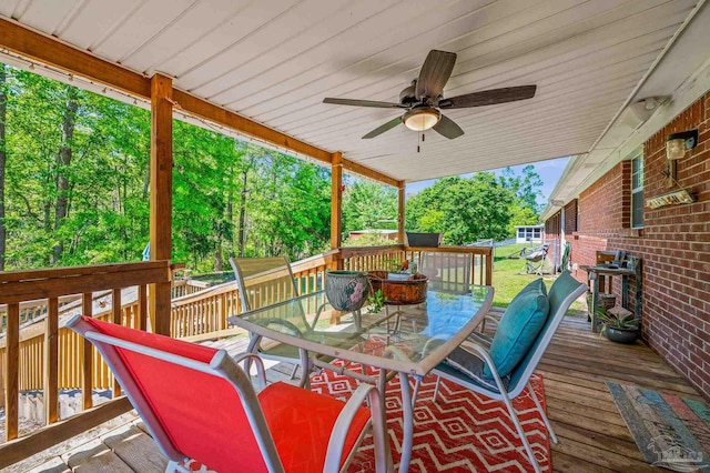 deck with a ceiling fan and outdoor dining area