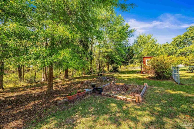 view of yard featuring a garden and fence