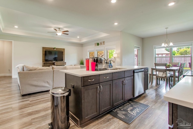 431 Broadleaf Cir, Cantonment, FL 32533 - kitchen with dishwasher, a sink, light countertops, a tray ceiling, and an island with sink
