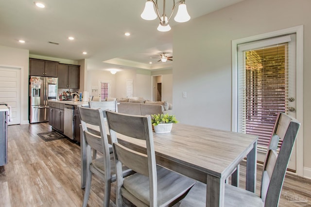 431 Broadleaf Cir, Cantonment, FL 32533 - dining room featuring recessed lighting, light wood-type flooring, a raised ceiling, ornamental molding, and a chandelier