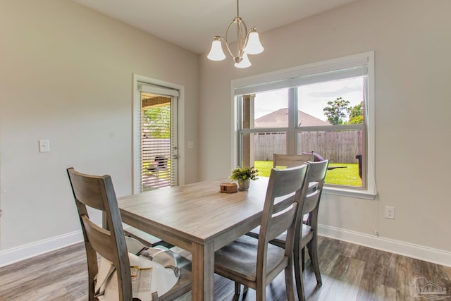 431 Broadleaf Cir, Cantonment, FL 32533 - dining space featuring a chandelier, baseboards, and wood finished floors