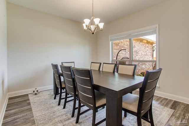 431 Broadleaf Cir, Cantonment, FL 32533 - dining space featuring baseboards, a chandelier, and wood finished floors