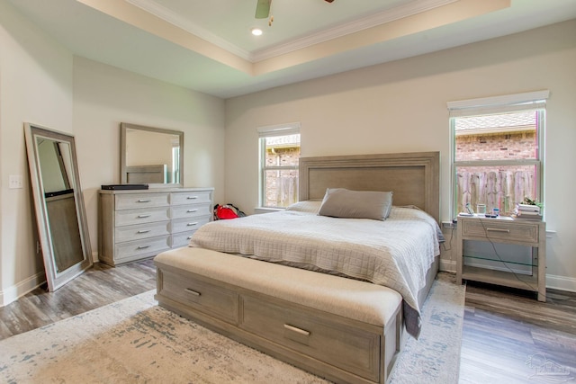 431 Broadleaf Cir, Cantonment, FL 32533 - bedroom with crown molding, light wood finished floors, baseboards, a tray ceiling, and recessed lighting