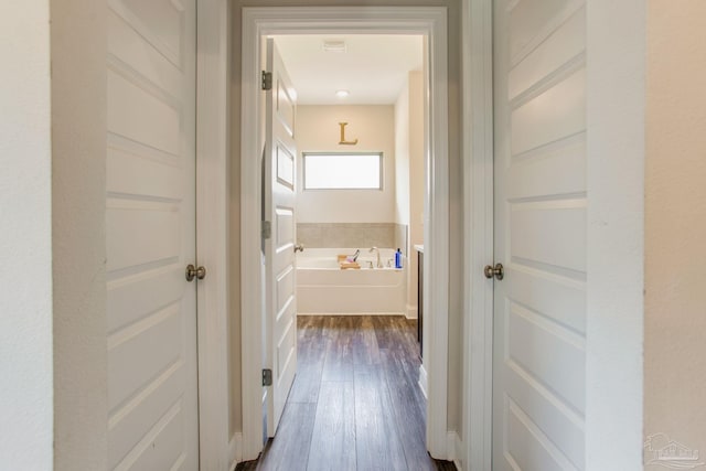 431 Broadleaf Cir, Cantonment, FL 32533 - hallway featuring dark wood-style floors