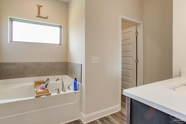 431 Broadleaf Cir, Cantonment, FL 32533 - full bath featuring a bath, vanity, wood finished floors, and baseboards