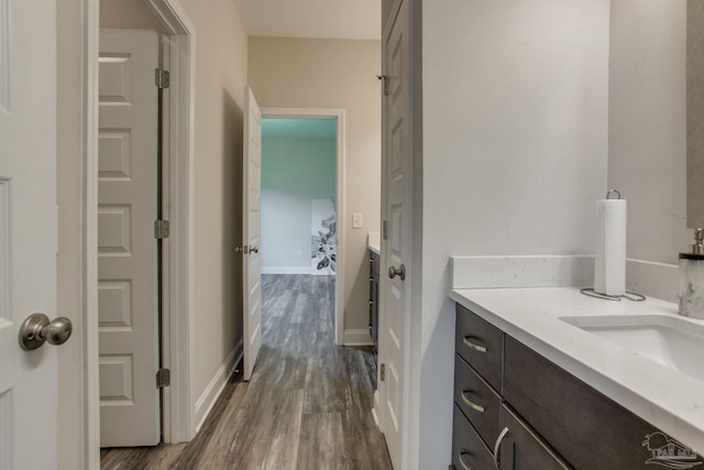 431 Broadleaf Cir, Cantonment, FL 32533 - bathroom featuring wood finished floors, vanity, and baseboards