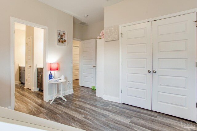 431 Broadleaf Cir, Cantonment, FL 32533 - bedroom with wood finished floors, baseboards, and a closet