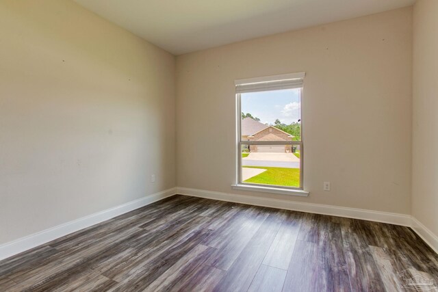 431 Broadleaf Cir, Cantonment, FL 32533 - empty room featuring dark wood-style floors and baseboards