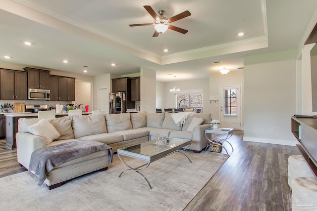 431 Broadleaf Cir, Cantonment, FL 32533 - living area with wood finished floors, a raised ceiling, a chandelier, a ceiling fan, and recessed lighting