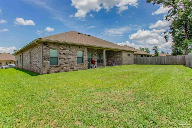 431 Broadleaf Cir, Cantonment, FL 32533 - back of house featuring brick siding and roof with shingles