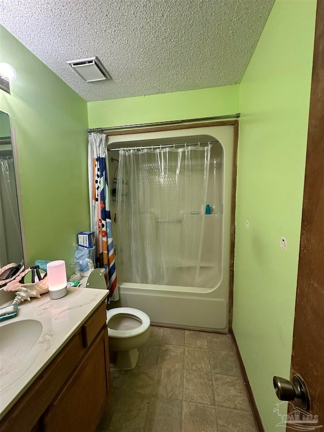 full bathroom featuring vanity, a textured ceiling, toilet, and shower / tub combo