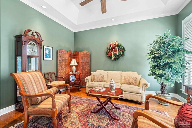 1788 Lorain Cir, Cantonment, FL 32533 - living area with wood finished floors, plenty of natural light, a ceiling fan, a tray ceiling, and ornamental molding