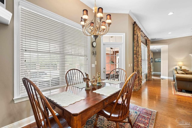 1788 Lorain Cir, Cantonment, FL 32533 - dining room with a chandelier, wood finished floors, baseboards, ornamental molding, and recessed lighting