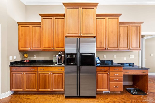1788 Lorain Cir, Cantonment, FL 32533 - kitchen featuring stainless steel fridge, wood finished floors, brown cabinets, and ornamental molding