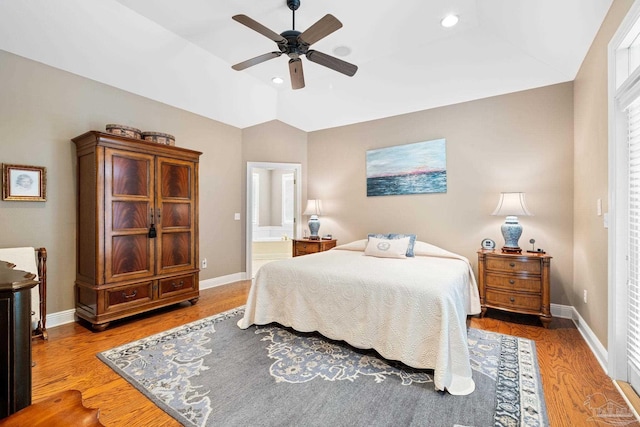 1788 Lorain Cir, Cantonment, FL 32533 - bedroom featuring wood finished floors, vaulted ceiling, baseboards, ensuite bath, and recessed lighting