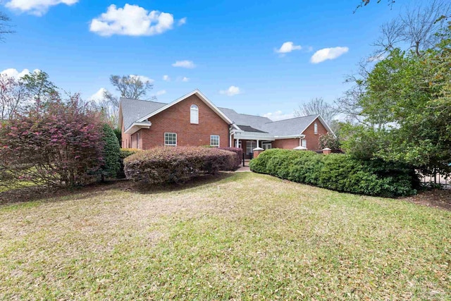 1788 Lorain Cir, Cantonment, FL 32533 - view of property exterior with brick siding and a lawn