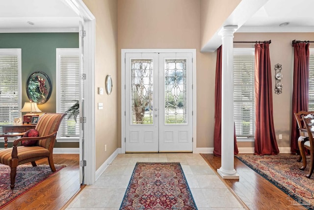 1788 Lorain Cir, Cantonment, FL 32533 - foyer featuring decorative columns, ornamental molding, baseboards, healthy amount of natural light, and french doors