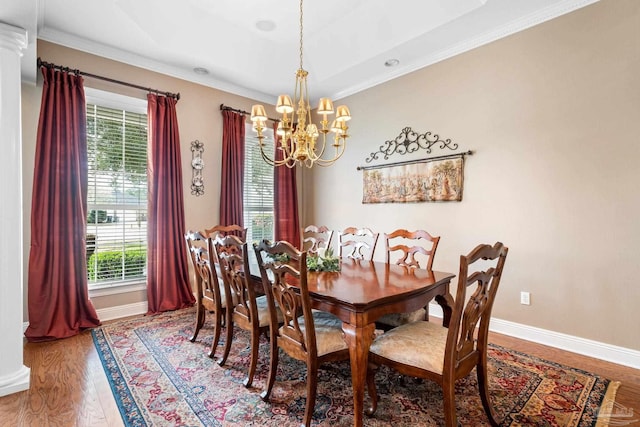 1788 Lorain Cir, Cantonment, FL 32533 - dining space with a chandelier, healthy amount of natural light, crown molding, baseboards, and wood finished floors