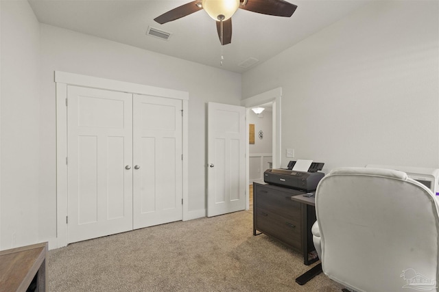 office featuring ceiling fan and light colored carpet