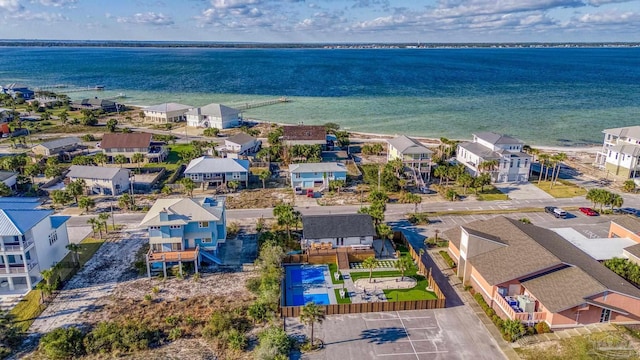 drone / aerial view featuring a residential view and a water view