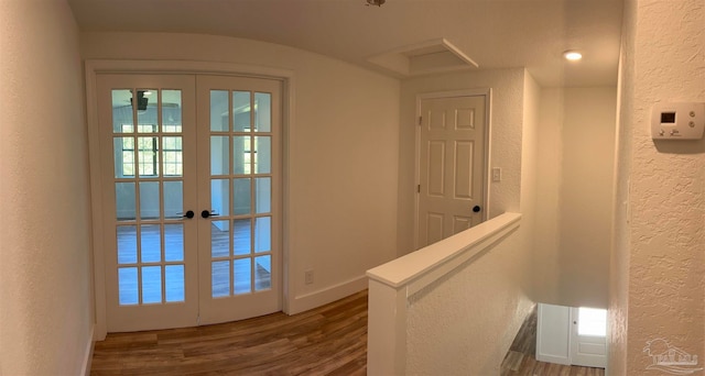 interior space with french doors and dark hardwood / wood-style flooring