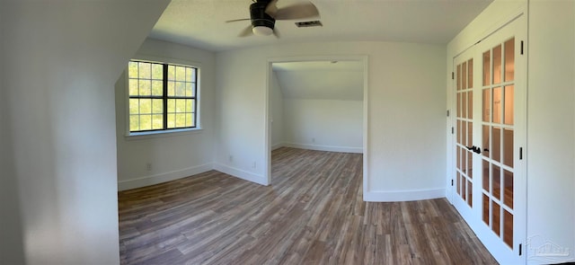 spare room with ceiling fan and wood-type flooring