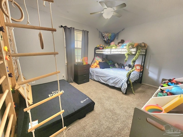 carpeted bedroom with ceiling fan and lofted ceiling
