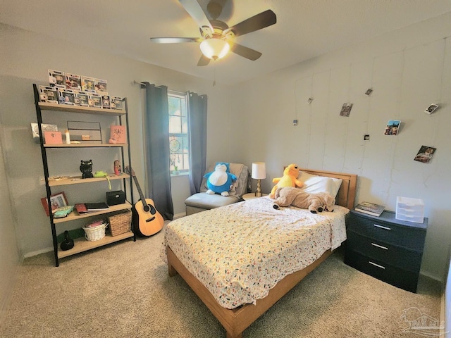 carpeted bedroom featuring ceiling fan and baseboards