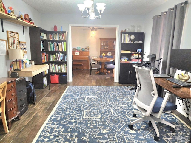 office area featuring ceiling fan with notable chandelier and wood finished floors