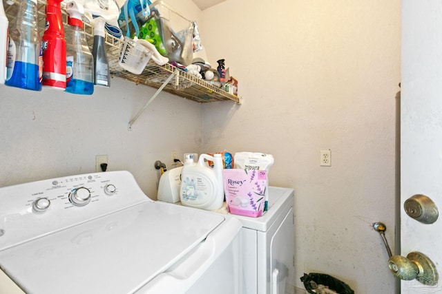 washroom with washer and dryer