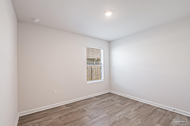 7581 Steeplechase Blvd, Pensacola, FL 32526 - empty room with wood finished floors and a smoke detector