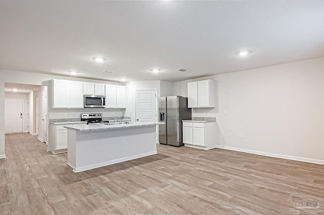 7581 Steeplechase Blvd, Pensacola, FL 32526 - kitchen with stainless steel appliances, light wood-style flooring, white cabinetry, and recessed lighting