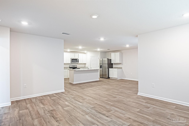 7581 Steeplechase Blvd, Pensacola, FL 32526 - unfurnished living room featuring recessed lighting and light wood finished floors