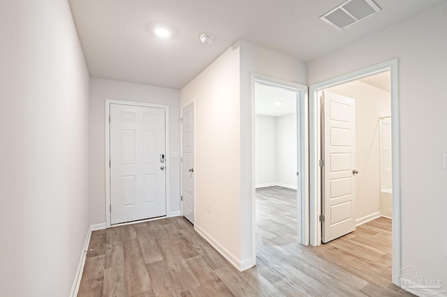 7581 Steeplechase Blvd, Pensacola, FL 32526 - hallway featuring light wood-type flooring and baseboards