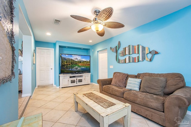 tiled living room with ceiling fan